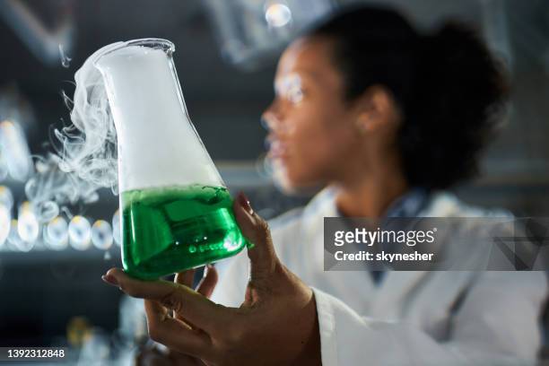close up of chemical reaction in laboratory. - volume fluid capacity stock pictures, royalty-free photos & images