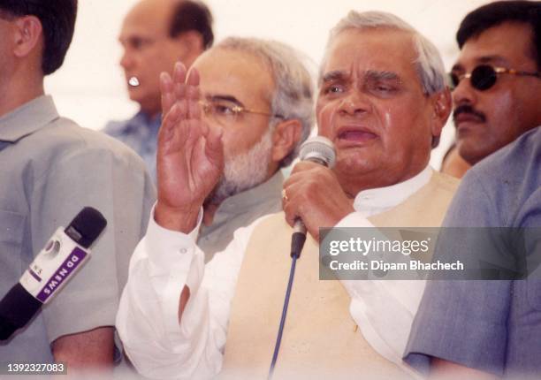 Atal Bihari Vajpayee visits relief camps at Shah E Alam in Ahmedabad Gujarat India on 4th April 2002. Along with him is Narendra Modi .