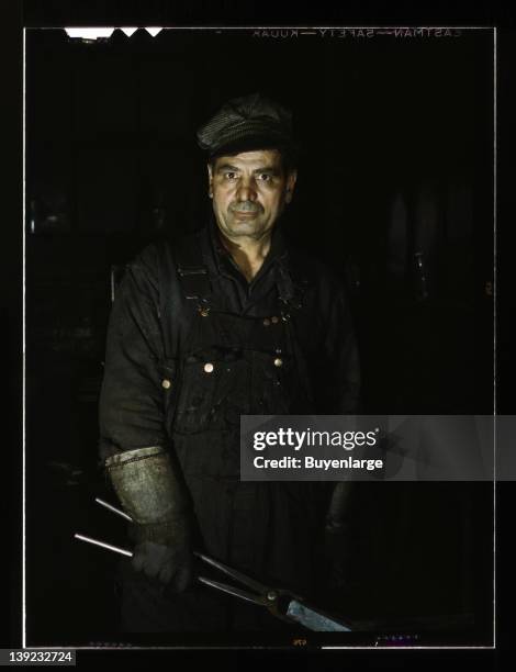 Blacksmith's helper at the roundhouse of the Rock Island R.R, Blue Island, Illinois, 1943.