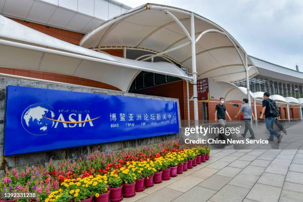 Journalists walk into the Boao Forum for Asia Press Center on April 19, 2022 in Qionghai, Hainan Province of China. The Boao Forum for Asia Annual...