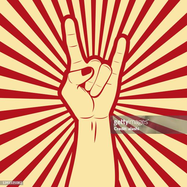 das rock and roll hand sign (das zeichen der hörner) propagandaplakat mit comic-effektzeilen im hintergrund - frauenpower stock-grafiken, -clipart, -cartoons und -symbole