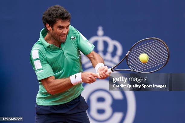 Pablo Andujar of Spain returns a ball to Ugo Humbert of France during day two of the Barcelona Open Banc Sabadell at Real Club De Tenis Barcelona on...