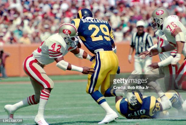 Los Angeles Rams Eric Dickerson runs against San Francisco 49'ers Ronnie Lott during Los Angeles Rams against San Francisco 49'ers game, September...