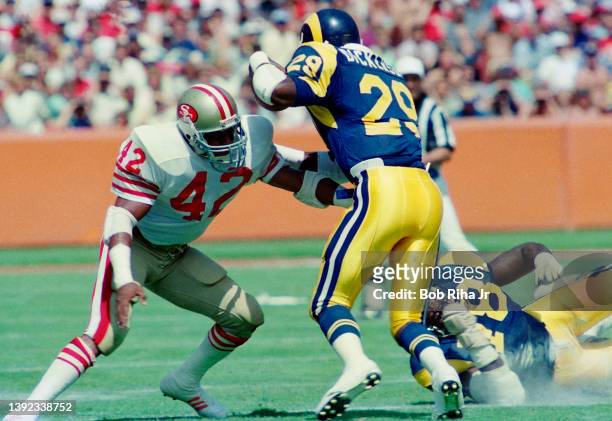 Los Angeles Rams Eric Dickerson runs against San Francisco 49'ers Ronnie Lott during Los Angeles Rams against San Francisco 49'ers game, September...