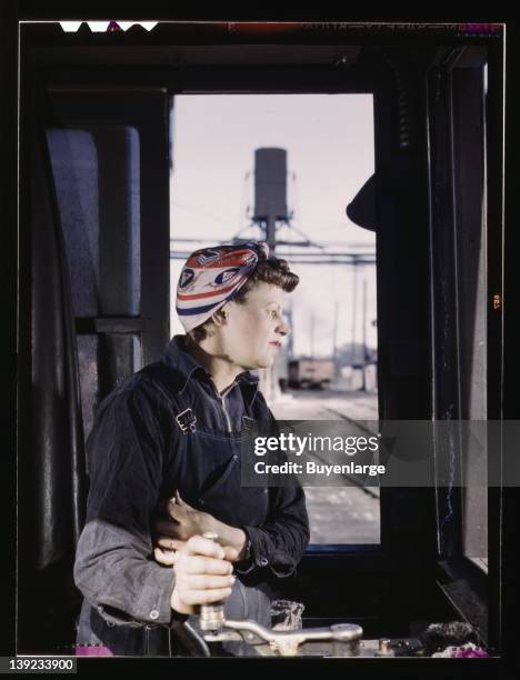 Woman helper at the roundhouse learning to operate the turntable, Clinton, Iowa, 1943.