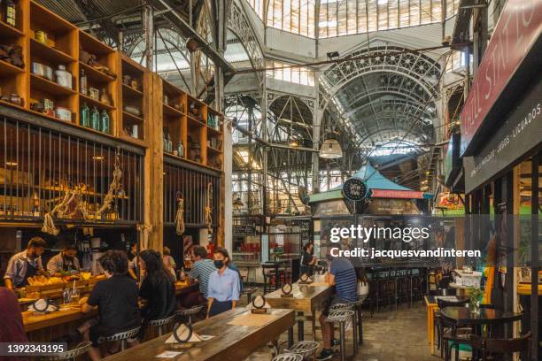 the public market in the san telmo district of buenos aires, argentina. the mercado de san telmo dates back to 1897 and is characterised by a lot of wrought iron - buenos aires san telmo stock pictures, royalty-free photos & images