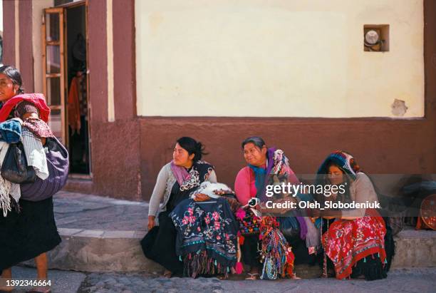 mayan women sitting on the street and selling traditional souvenirs - mexican street market stock pictures, royalty-free photos & images