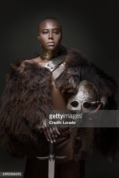 beautiful black viking inspired warrior princess in studio shot - african queen stock pictures, royalty-free photos & images