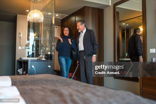 heterosexual retired couple in an elegant hotel room - charmig bildbanksfoton och bilder