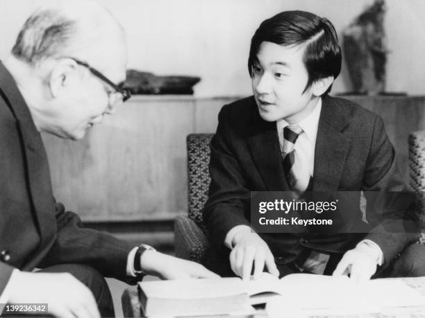 Prince Hiro, aka Crown Prince Naruhito of Japan, being lectured by Tomohide Gomi, Honorary Professor of Tokyo University, on the 'Manyoshu' poetry...