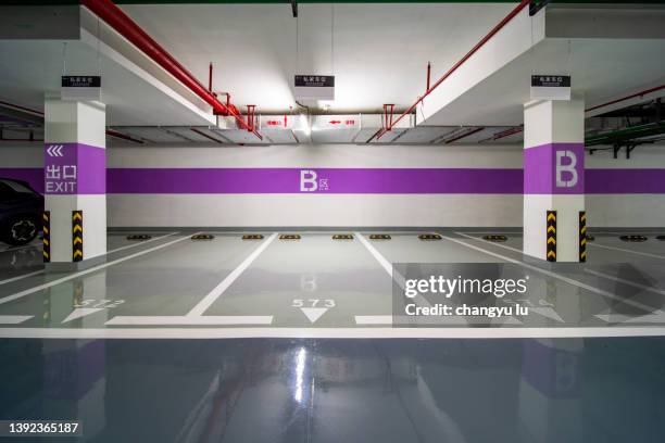 underground parking lot - parking garage stock-fotos und bilder