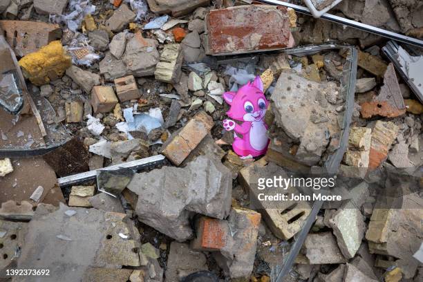 Rubble lies outside a kindergarten that was bombed during the Russian invasion west of Kyiv on April 19, 2022 in Makariv, Ukraine. Neighbors said a...
