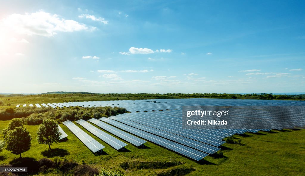Solar cells energy farm in countryside landscape