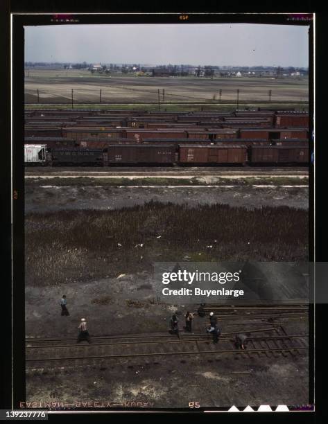 Section crew at work on the track, Chicago, Milwaukee, St. Paul and Pacific Railroad & Pennsylvania Railroad yard, Bensonville, Illinois, 1943.