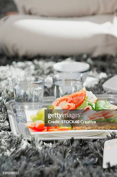 plate with grapes, tomatoes and bread roll - b roll stock pictures, royalty-free photos & images