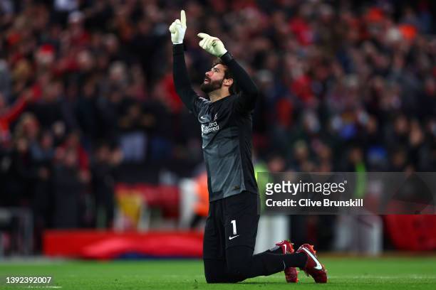 Alisson Becker of Liverpool celebrates after Luis Diaz scores their side's first goal during the Premier League match between Liverpool and...