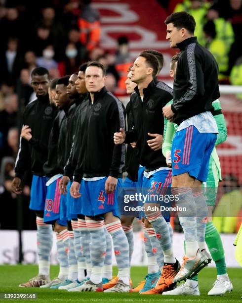 Manchester United players walk out ahead of the Premier League match between Liverpool and Manchester United at Anfield on April 19, 2022 in...