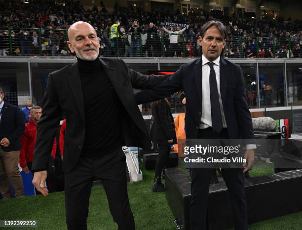 Head coach of AC Milan Stefano Pioli shakes hands with head coach of FC Internazionale Simone Inzaghi before the Coppa Italia Semi Final 2nd Leg...