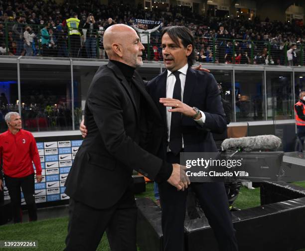 Head coach of AC Milan Stefano Pioli shakes hands with head coach of FC Internazionale Simone Inzaghi before the Coppa Italia Semi Final 2nd Leg...