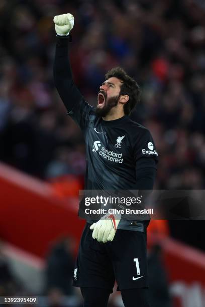 Alisson Becker of Liverpool celebrates after Mohamed Salah of Liverpool scores their side's second goal during the Premier League match between...