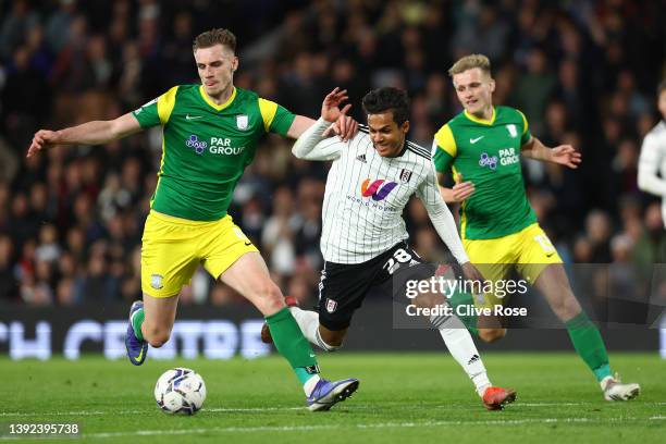 Liam Lindsay of Preston North End is challenged by Fabio Carvalho of Fulham during the Sky Bet Championship match between Fulham and Preston North...