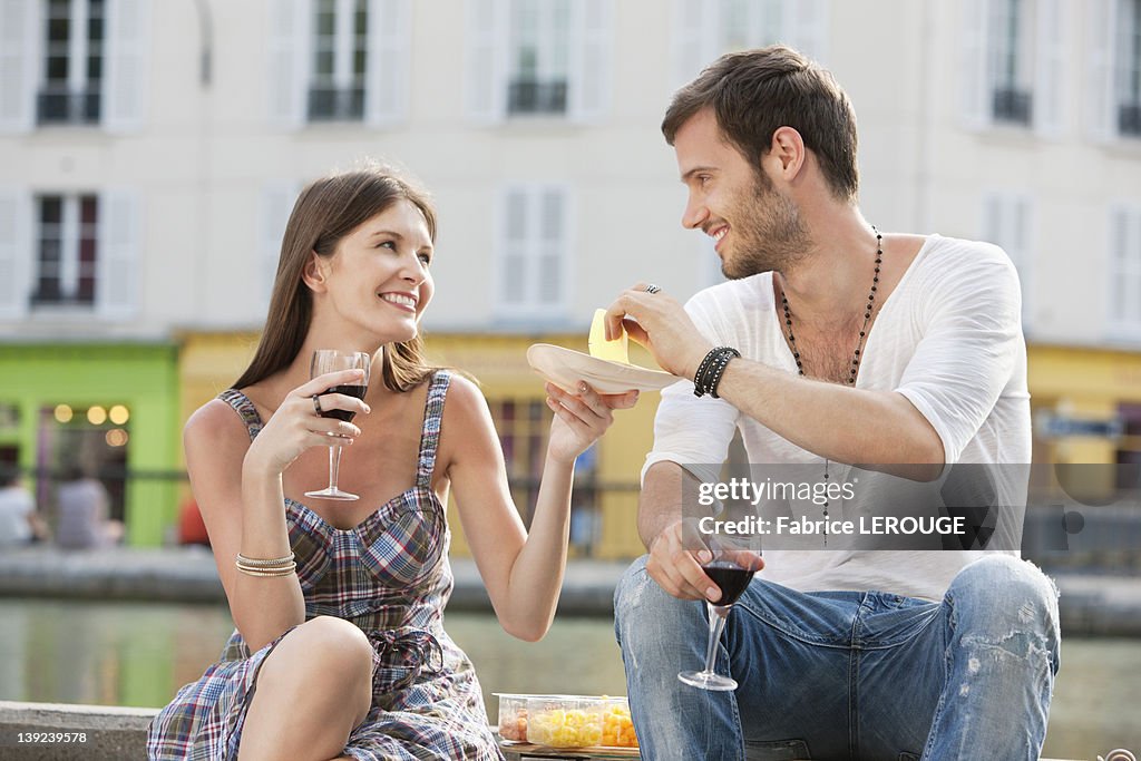 Couple drinking red wine, Paris, Ile-de-France, France