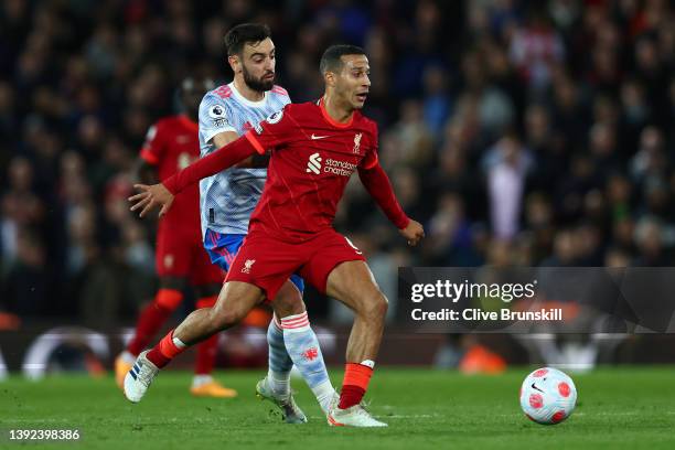 Bruno Fernandes of Manchester United challenges Thiago Alcantara of Liverpool during the Premier League match between Liverpool and Manchester United...