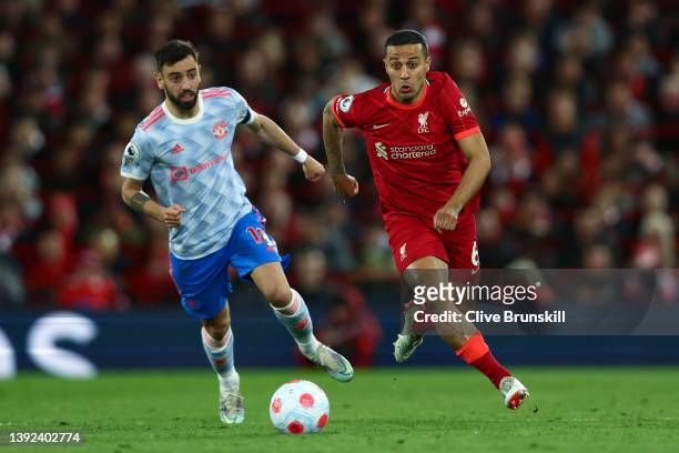 Bruno Fernandes of Manchester United looks on as Thiago Alcantara of Liverpool runs with the ball during the Premier League match between Liverpool...