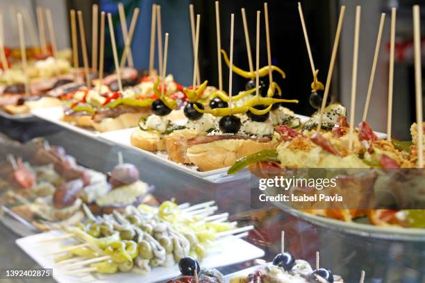 close-up of typical pintxos and tapas, on a bar counter in spain - bar counter traditional stock-fotos und bilder