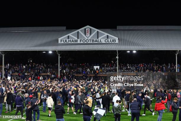 Fulham fans invade the pitch as they celebrate their side's promotion to the Premier League following victory in the Sky Bet Championship match...