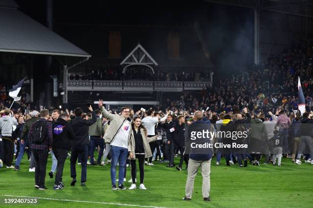 Fulham fans invade the pitch as they celebrate their side's promotion to the Premier League following victory in the Sky Bet Championship match...