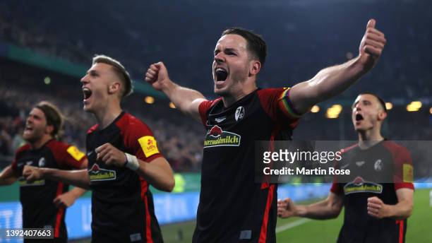 Vincenzo Grifo of SC Freiburg celebrates their side's win after the final whistle of the DFB Cup semi final match between Hamburger SV and SC...