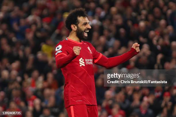 Mohamed Salah of Liverpool celebrates scoring his side's fourth goal during the Premier League match between Liverpool and Manchester United at...