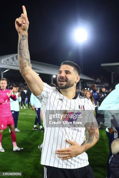 Aleksandar Mitrovic of Fulham celebrates their side's promotion to the Premier League following victory the Sky Bet Championship match between Fulham...