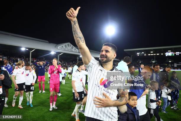 Aleksandar Mitrovic of Fulham celebrates their side's promotion to the Premier League following victory the Sky Bet Championship match between Fulham...