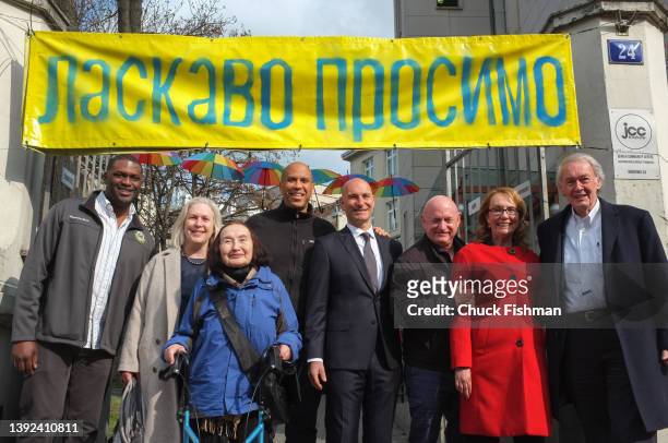 Portrait of members of a US Congressional delegation and others as they pose at entrance to the Jewish Community Center of Krakow, Krakow, Poland,...