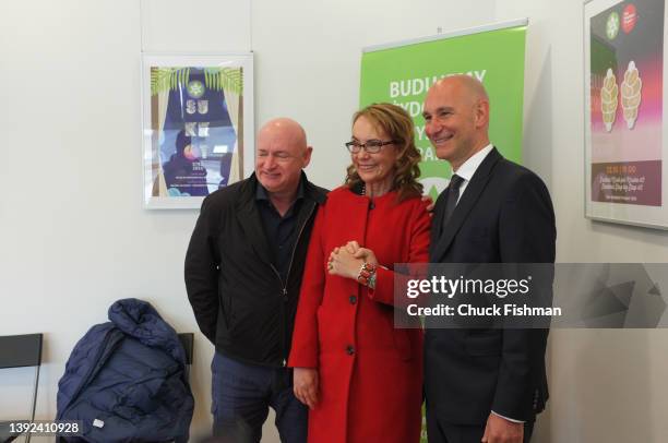 Representative Gabrielle Giffords centre, with Senator Mark Kelly, left and JCC Executive Director Jonathan Ornstein, right, at the Jewish Community...