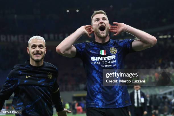 Federico Dimarco and Milan Skriniar of FC Internazionale celebrates their side's win after the final whistle of the Coppa Italia Semi Final 2nd Leg...