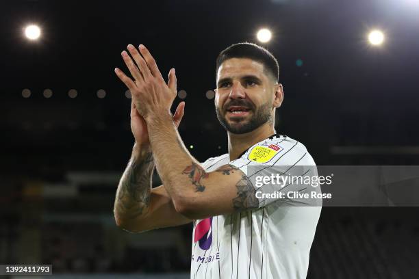 Aleksandar Mitrovic of Fulham celebrates their side's promotion to the Premier League following victory the Sky Bet Championship match between Fulham...