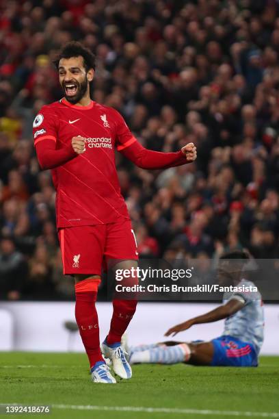 Mohamed Salah of Liverpool celebrates scoring his side's fourth goal during the Premier League match between Liverpool and Manchester United at...