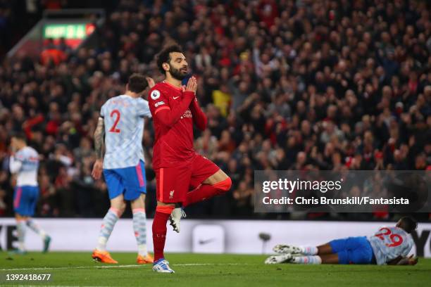 Mohamed Salah of Liverpool celebrates scoring his side's fourth goal during the Premier League match between Liverpool and Manchester United at...