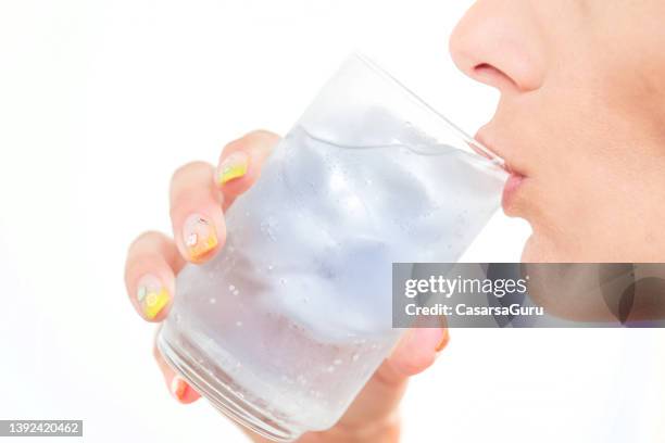 drinking ice cold glass of water - drinking cold drink stock pictures, royalty-free photos & images