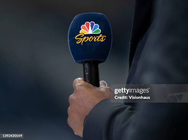 The official NBC Sports interview microphone in the hand of a pundit ahead of the Premier League match between Newcastle United and Wolverhampton...