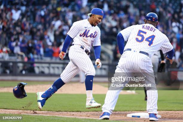 Francisco Lindor of the New York Mets throws his helmet after hitting a walk-off single during the tenth inning of the game against the San Francisco...