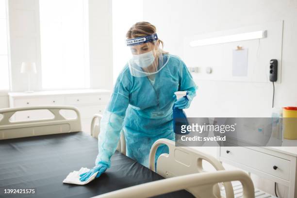 nurse cleaning hospital ward. - desinfetar imagens e fotografias de stock