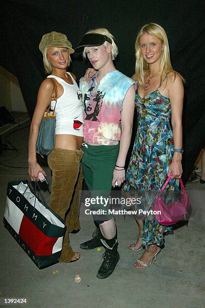 Socialite Paris Hilton, club kid Richie Rich, and socialite Nicky Hilton attend the Heatherette Spring/Summer 2003 collection during the...