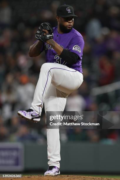 Pitcher Alex Colome of the Colorado Rockies throws against the Philadelphia Phillies in the ninth inning at Coors Field on April 18, 2022 in Denver,...