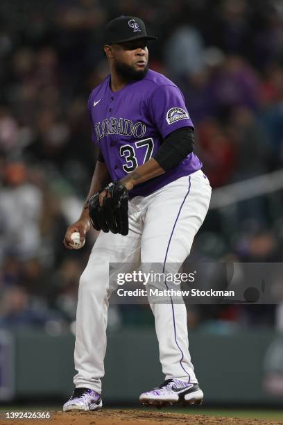 Pitcher Alex Colome of the Colorado Rockies throws against the Philadelphia Phillies in the ninth inning at Coors Field on April 18, 2022 in Denver,...