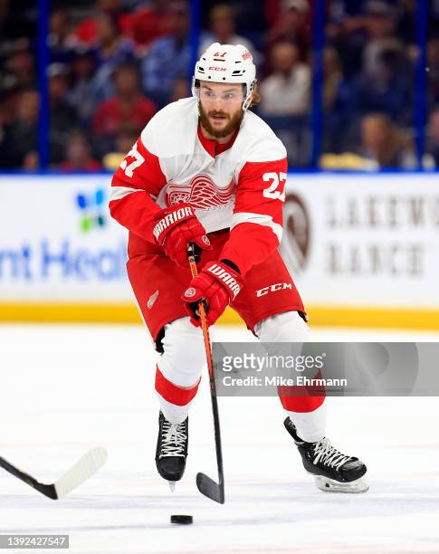 Michael Rasmussen of the Detroit Red Wings looks to pass in the first period during a game against the Tampa Bay Lightning at Amalie Arena on April...