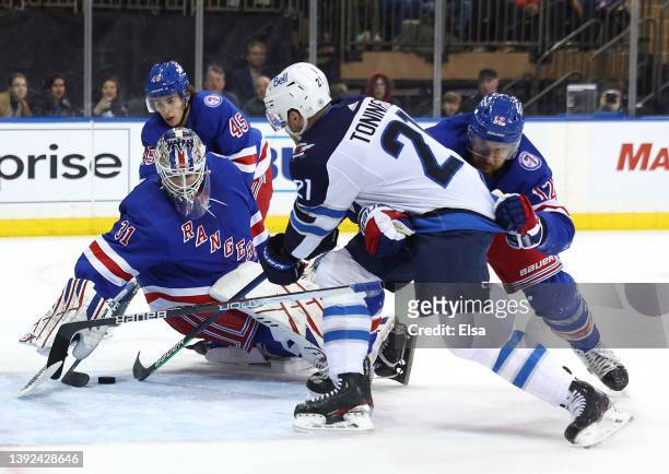 Igor Shesterkin of the New York Rangers stops a shot by Dominic Toninato of the Winnipeg Jets during the first period at Madison Square Garden on...